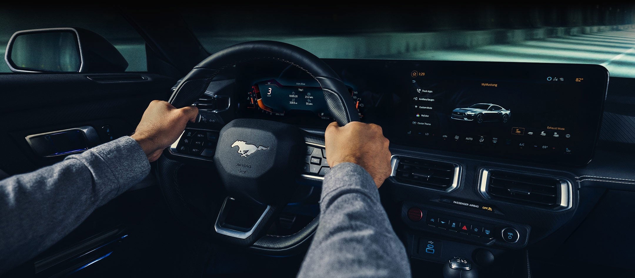 A 2024 Ford Mustang® model interior with a person driving | Donley Ford of Ashland, Inc. in Ashland OH